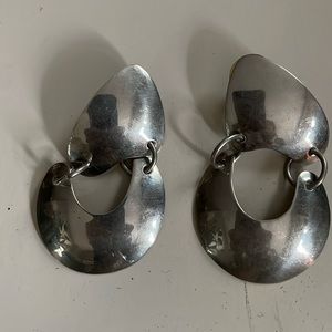 Unique designer post earrings. Silver colour. Soft contours. Like New.
